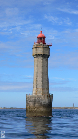 La Jument lighthouse on a blue sky background - Phare de La Jument sur un fond de ciel bleu